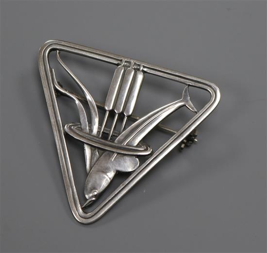 A Danish Georg Jensen sterling silver triangular dolphin brooch, no. 257, 37mm.